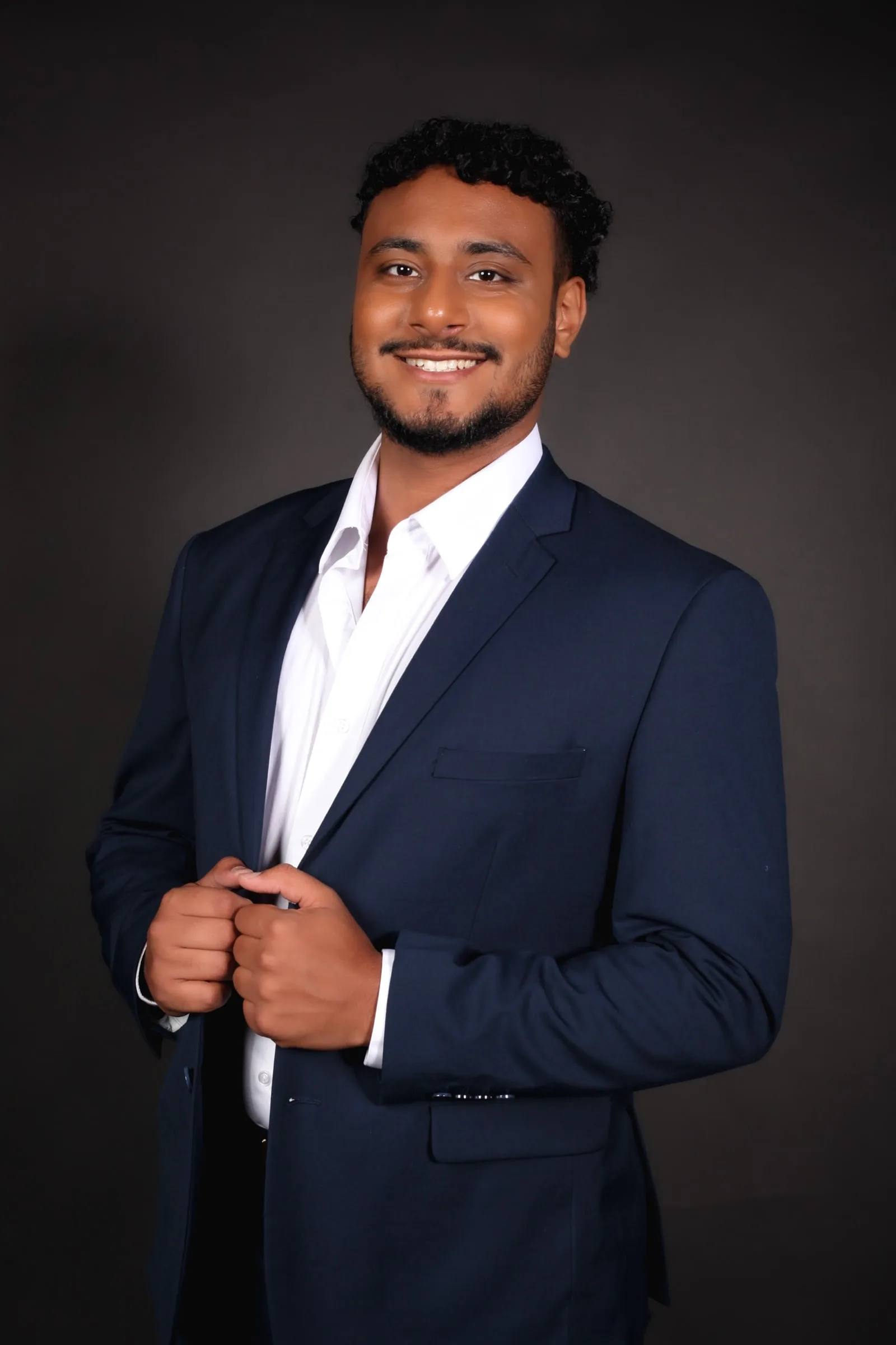 Portrait of Basel Awwad in a navy blazer